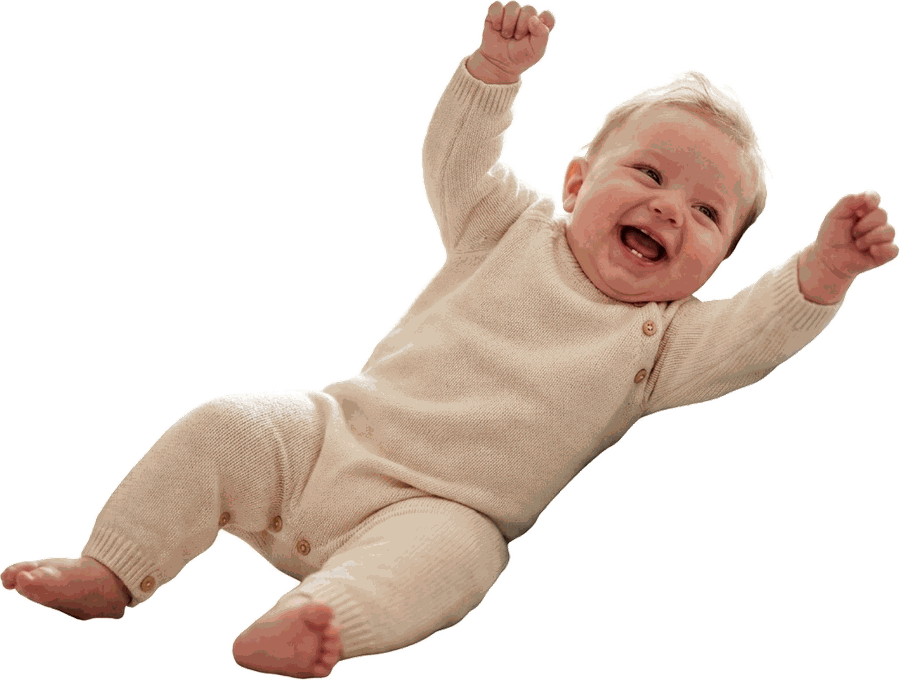 A baby lying on their back mid-wriggle, both arms flung up, laughing — the sort of photo you actually have